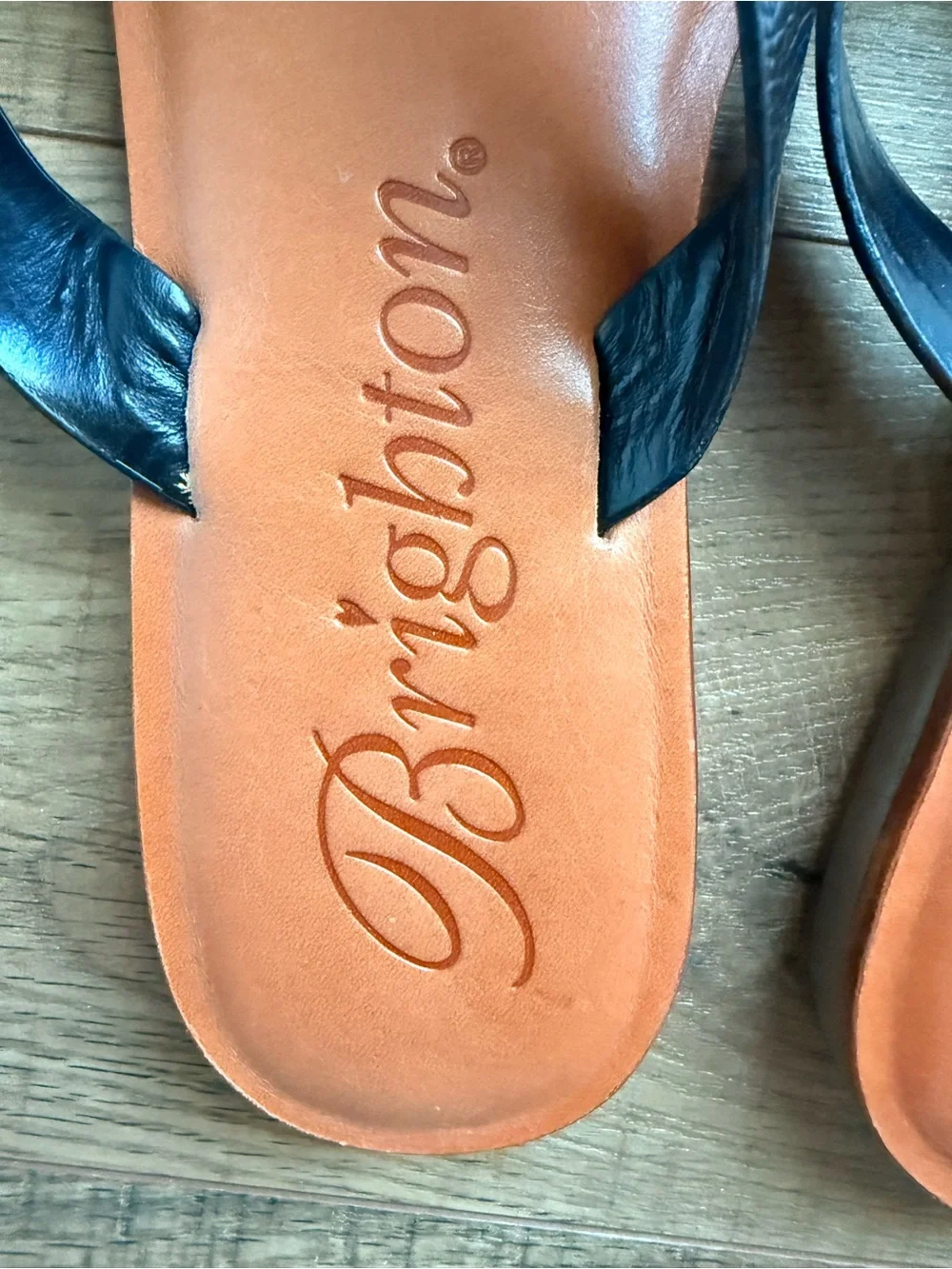 Brighton Black-Strap Sandals with Orange Footbeds and Silver Floral Accents